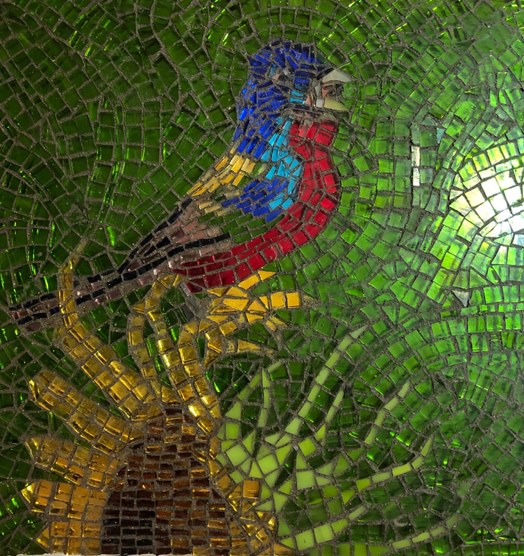 Mosaic version of the painted bunting sitting on a sunflower.